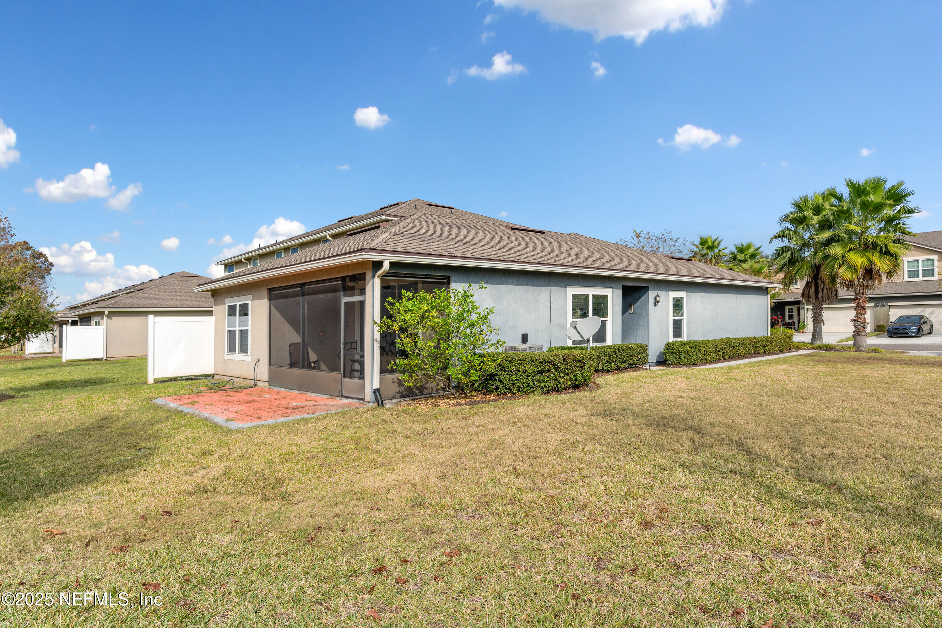 3165 Chestnut Ridge Way Orange Park, FL 32065 - Photo 26 of 35 a front view of a house with a yard and garage