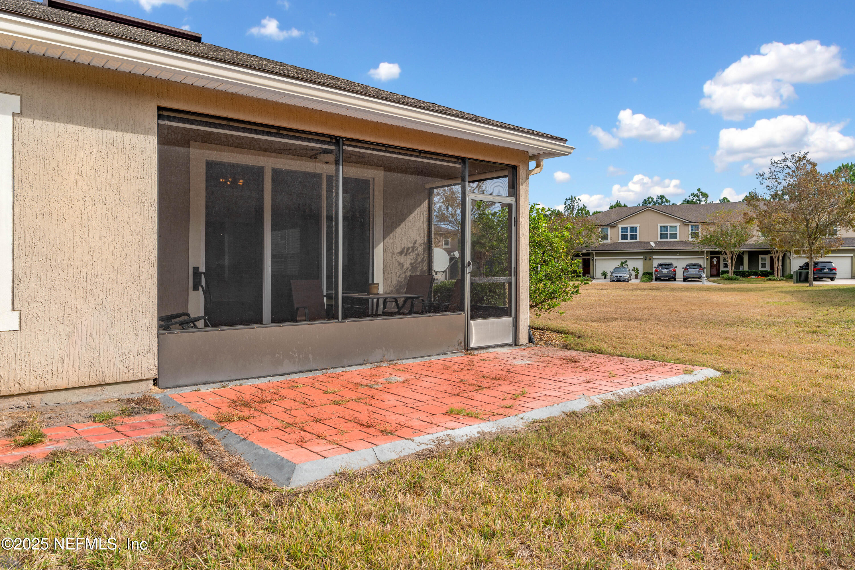 3165 Chestnut Ridge Way Orange Park, FL 32065 - Photo 29 of 35 a swimming pool with yard in front of it
