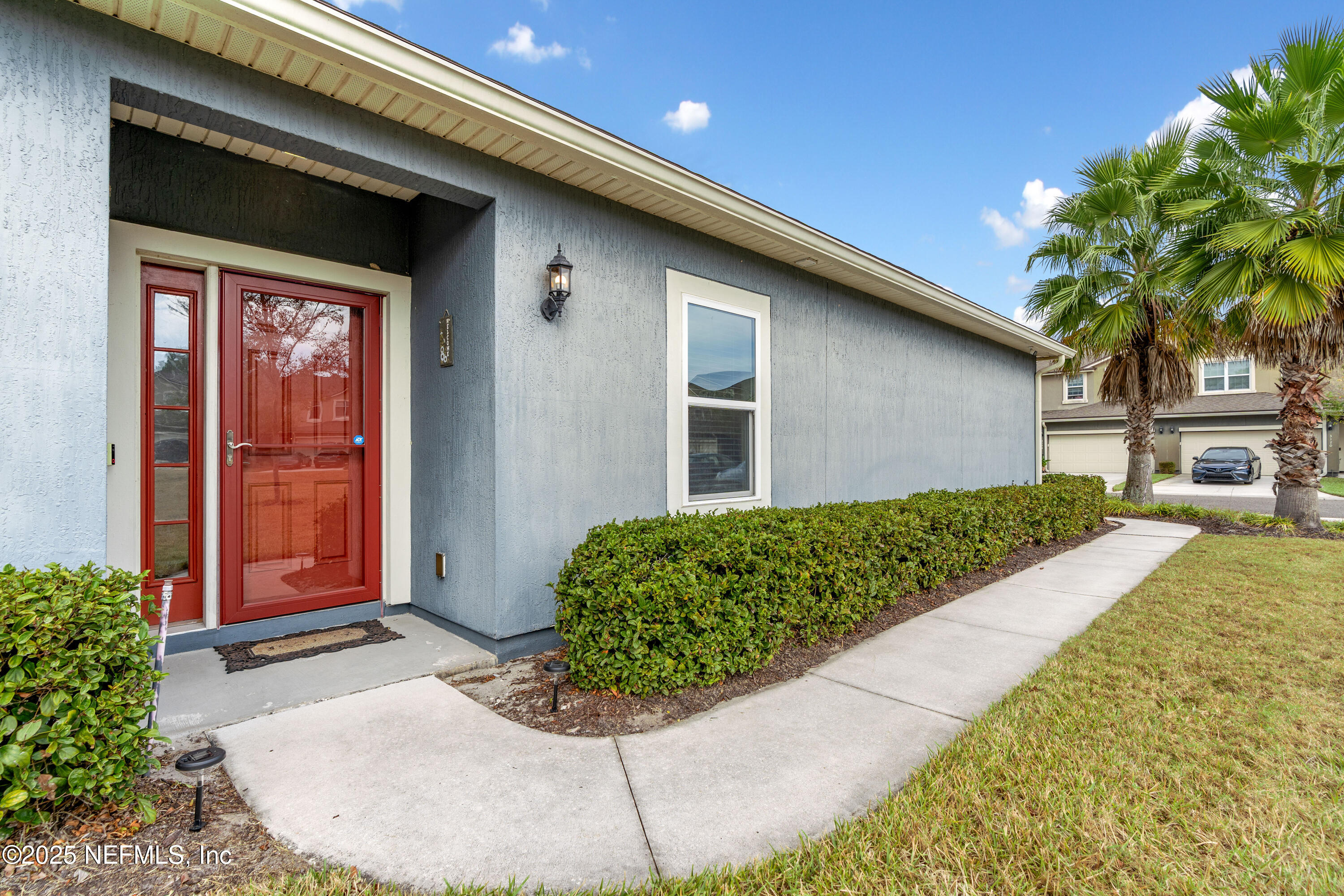 3165 Chestnut Ridge Way Orange Park, FL 32065 - Photo 3 of 35 a front view of a house with garden
