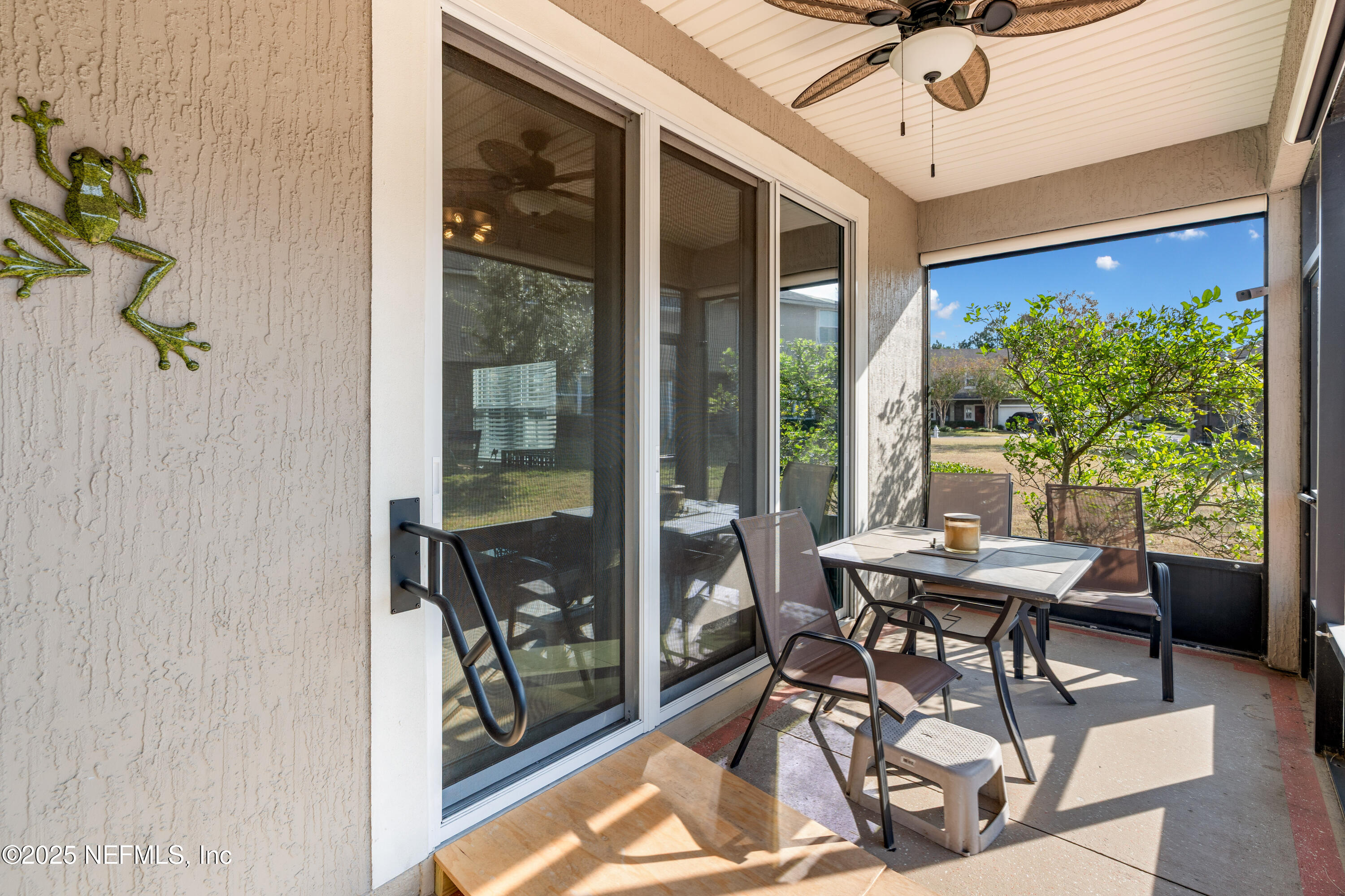 3165 Chestnut Ridge Way Orange Park, FL 32065 - Photo 31 of 35 a dining room with furniture a chandelier and a rug