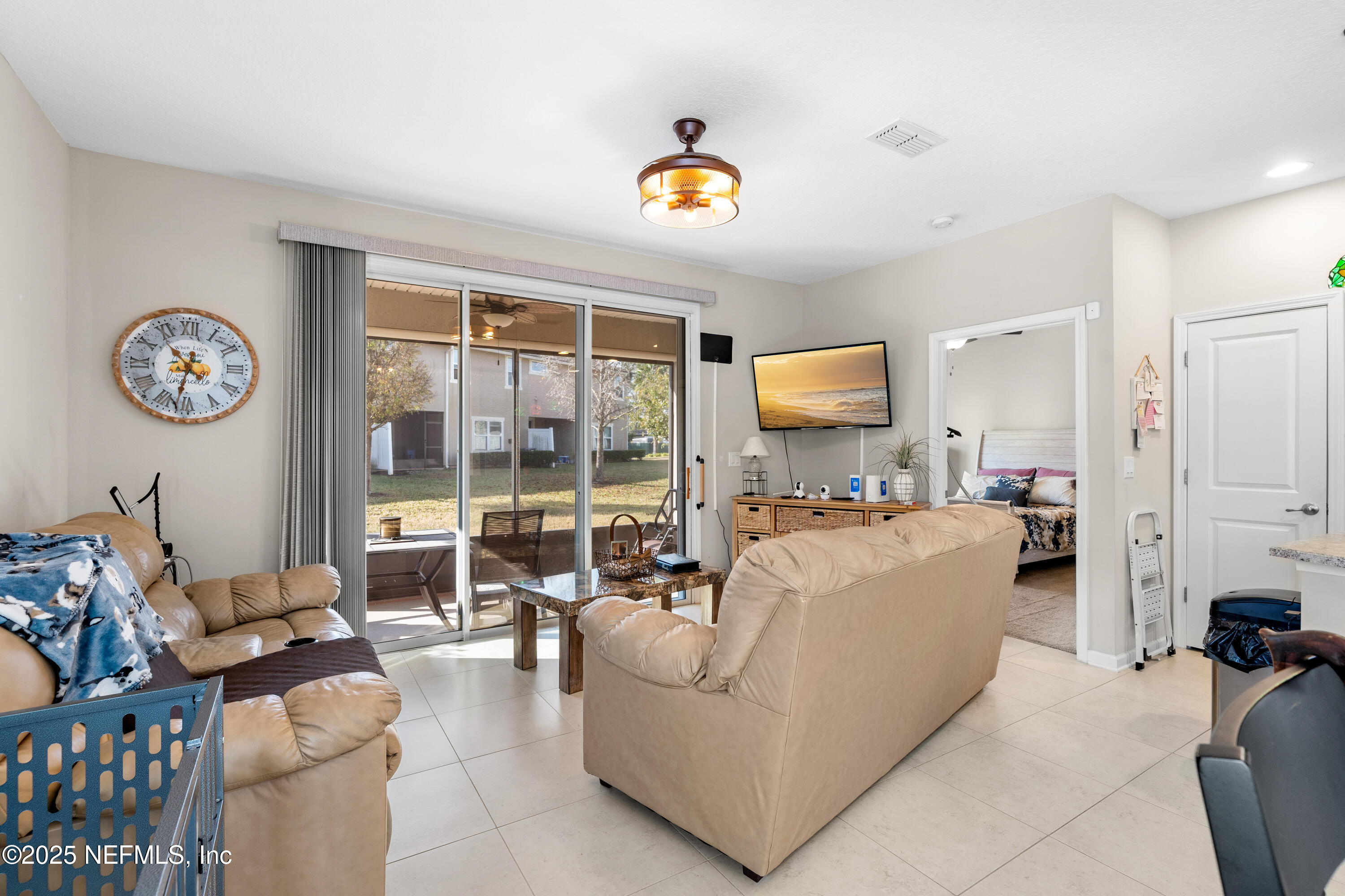 3165 Chestnut Ridge Way Orange Park, FL 32065 - Photo 9 of 35 a living room with furniture and a table