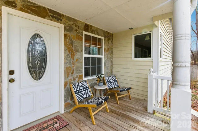 a view of a dinning room with furniture and front door