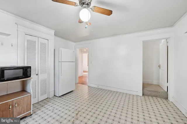 a kitchen with a sink cabinets and appliances