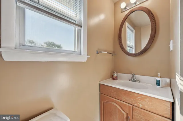 a kitchen with a sink cabinets and window