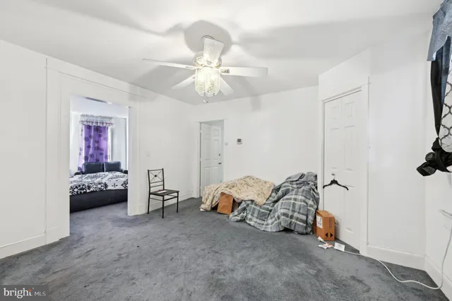 a bedroom with a bed and a mirror