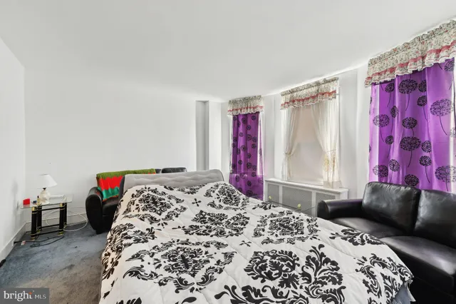 an empty room with a empty space and windows