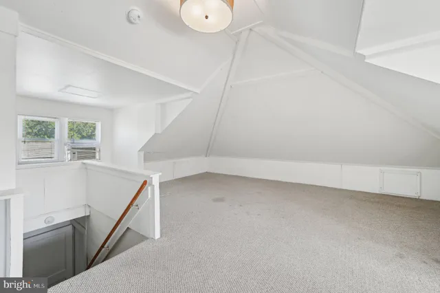 a view of a house with a yard and a garage