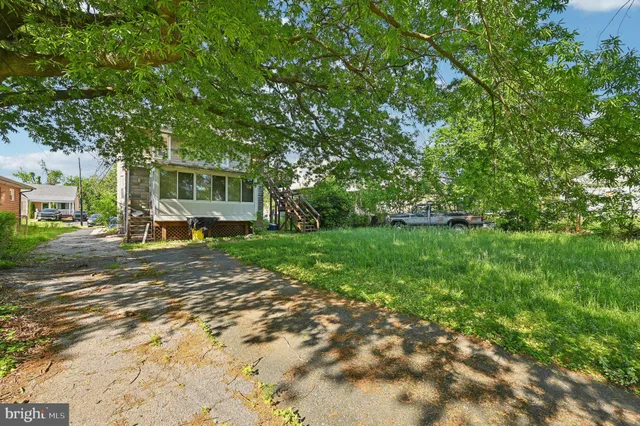 a view of a house with a back yard