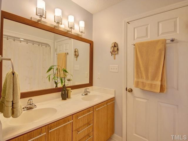 8804 Broadmore Court Raleigh, NC 27613 - Photo 16 of 23 This is the master bath added on in 2005! Features his/her sinks and linen closet! Great place to get ready for your day! Master Bath/Spa