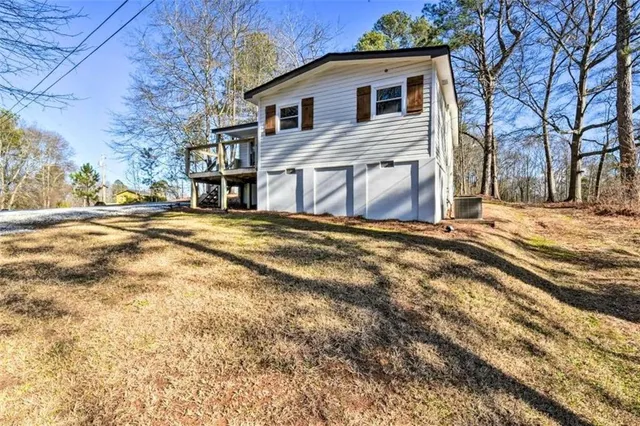 a view of a house with a snow in the yard