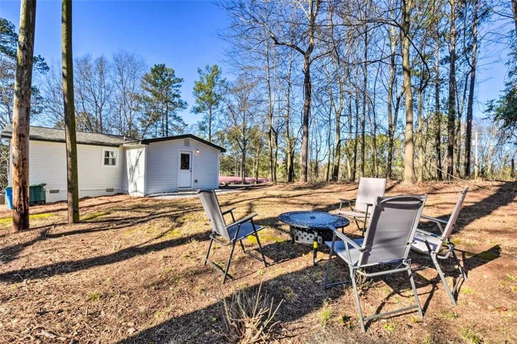 321 Pine Avenue Commerce, GA 30529 - Photo 5 of 5 a view of backyard with swimming pool and outdoor seating