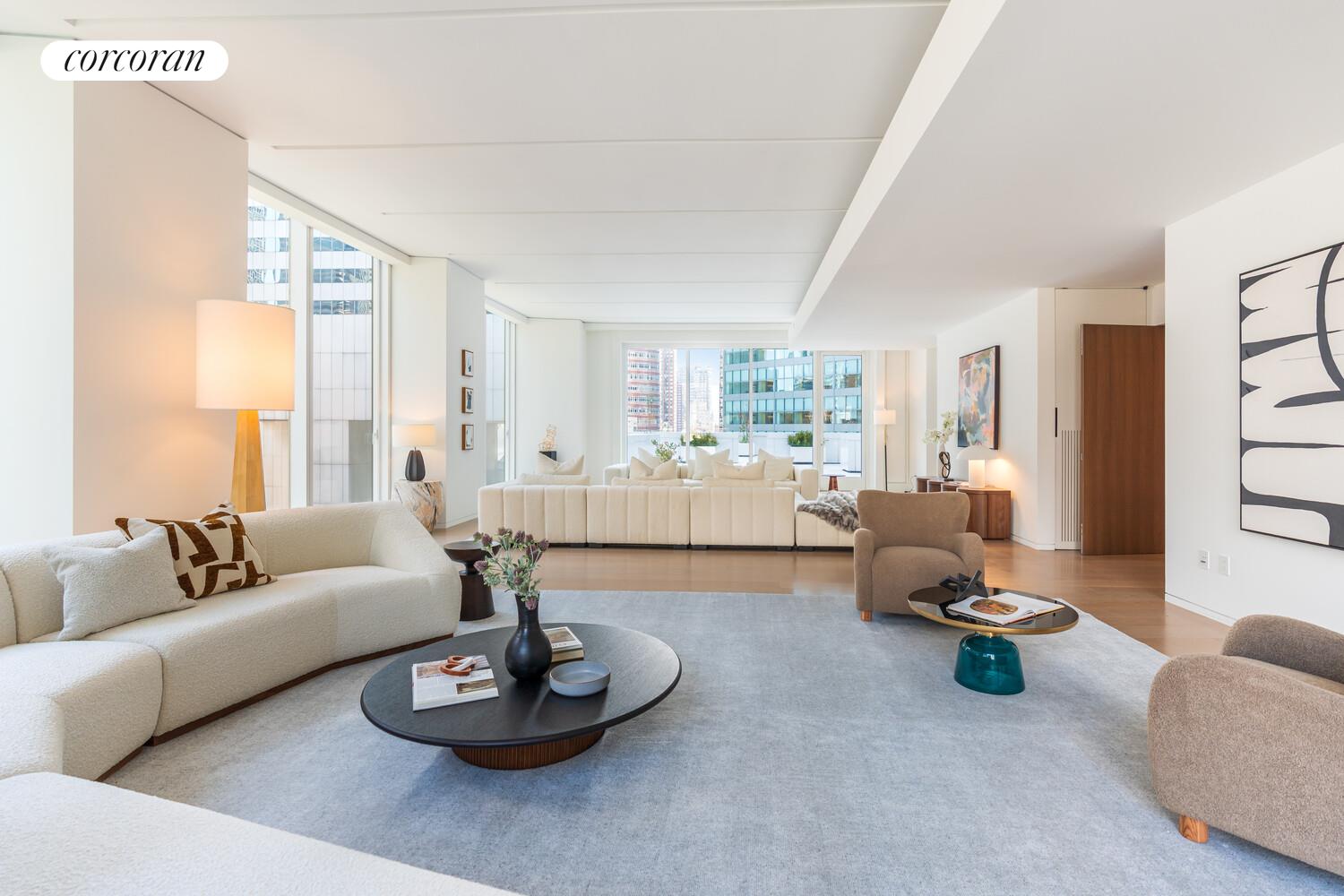 100 East 53rd Street, Unit 10A Manhattan, NY 10022 - Photo 10 of 35 a living room with furniture and a large window