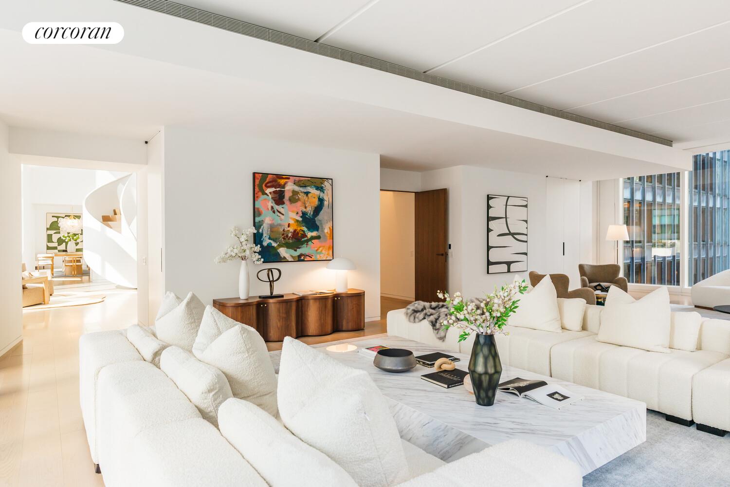 100 East 53rd Street, Unit 10A Manhattan, NY 10022 - Photo 11 of 35 a living room with furniture and a potted plant