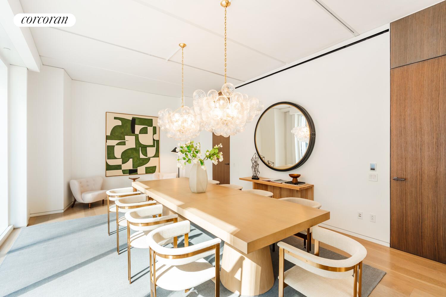 100 East 53rd Street, Unit 10A Manhattan, NY 10022 - Photo 16 of 35 a dining room with a table and chairs