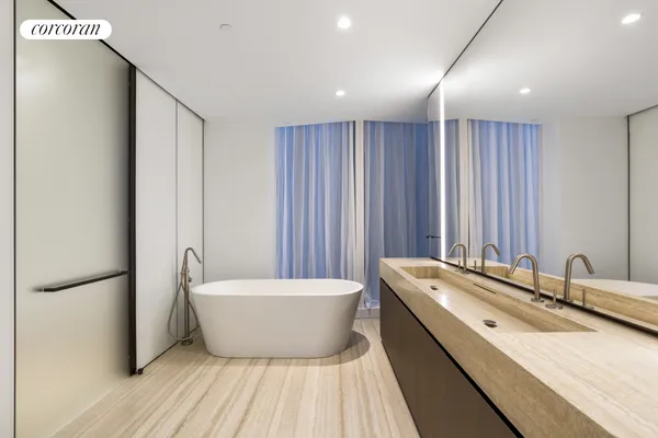 a bathroom with a granite countertop sink a mirror and a toilet