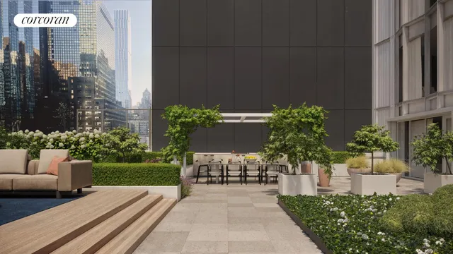 a view of a chair and table in backyard of the house