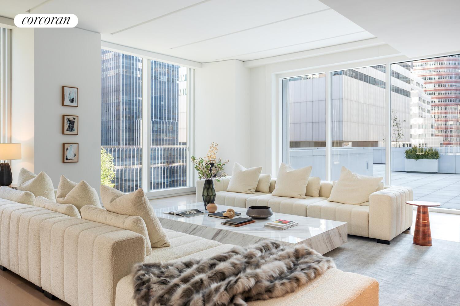 100 East 53rd Street, Unit 10A Manhattan, NY 10022 - Photo 8 of 35 a living room with furniture and a large window