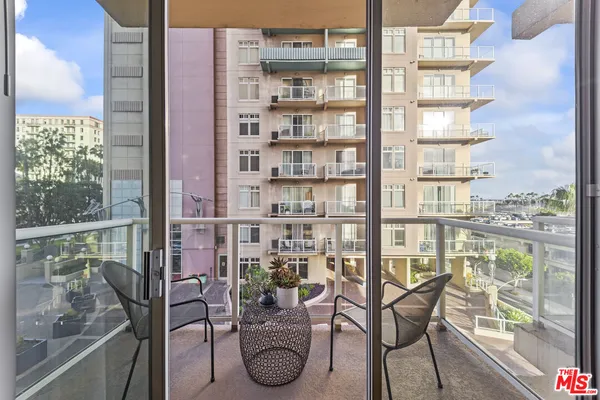 a view of a balcony with chairs