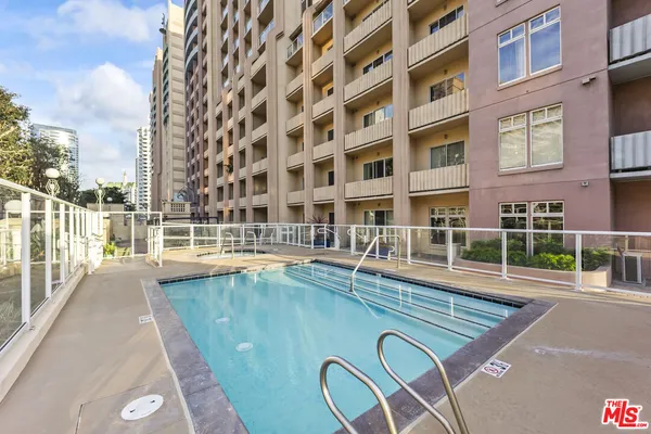 a view of a swimming pool with a lounge chairs