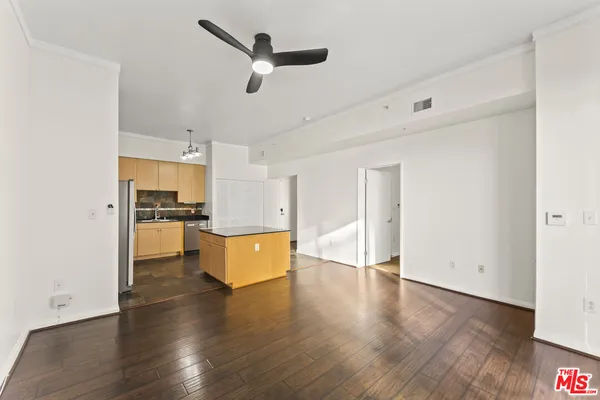 a view of kitchen with sink and wooden floor