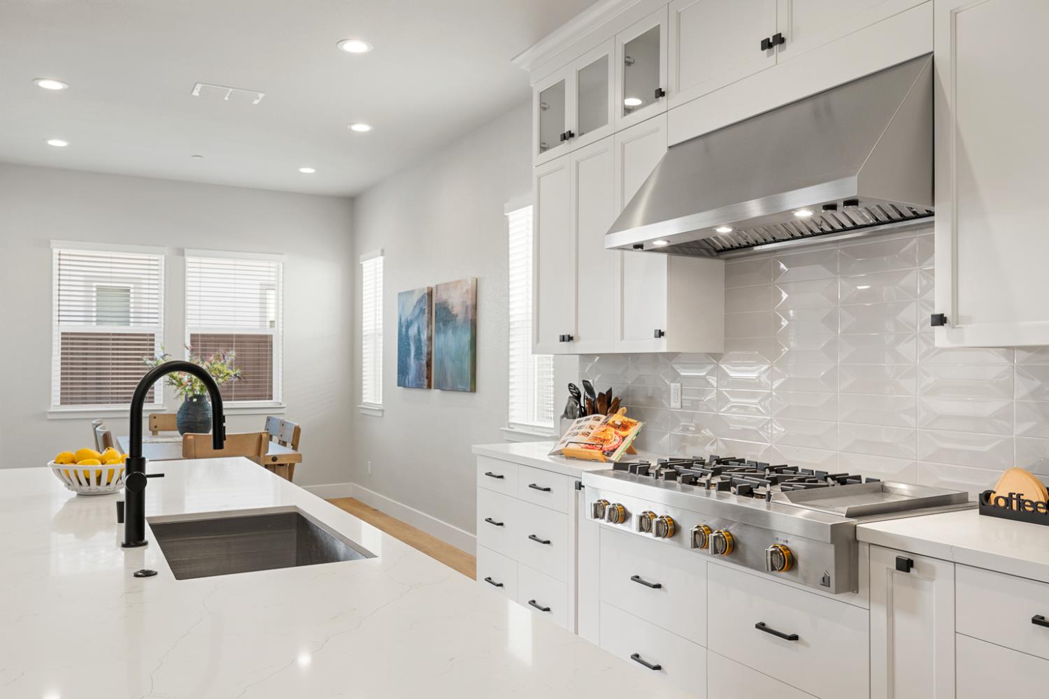 4228 Grey Hawk Street Folsom, CA 95630 - Photo 11 of 49 a kitchen with a stove a sink a refrigerator and cabinets