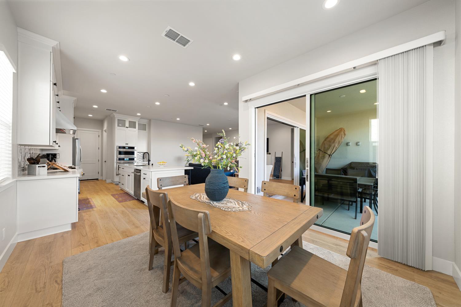4228 Grey Hawk Street Folsom, CA 95630 - Photo 19 of 49 a dining room with furniture and a kitchen