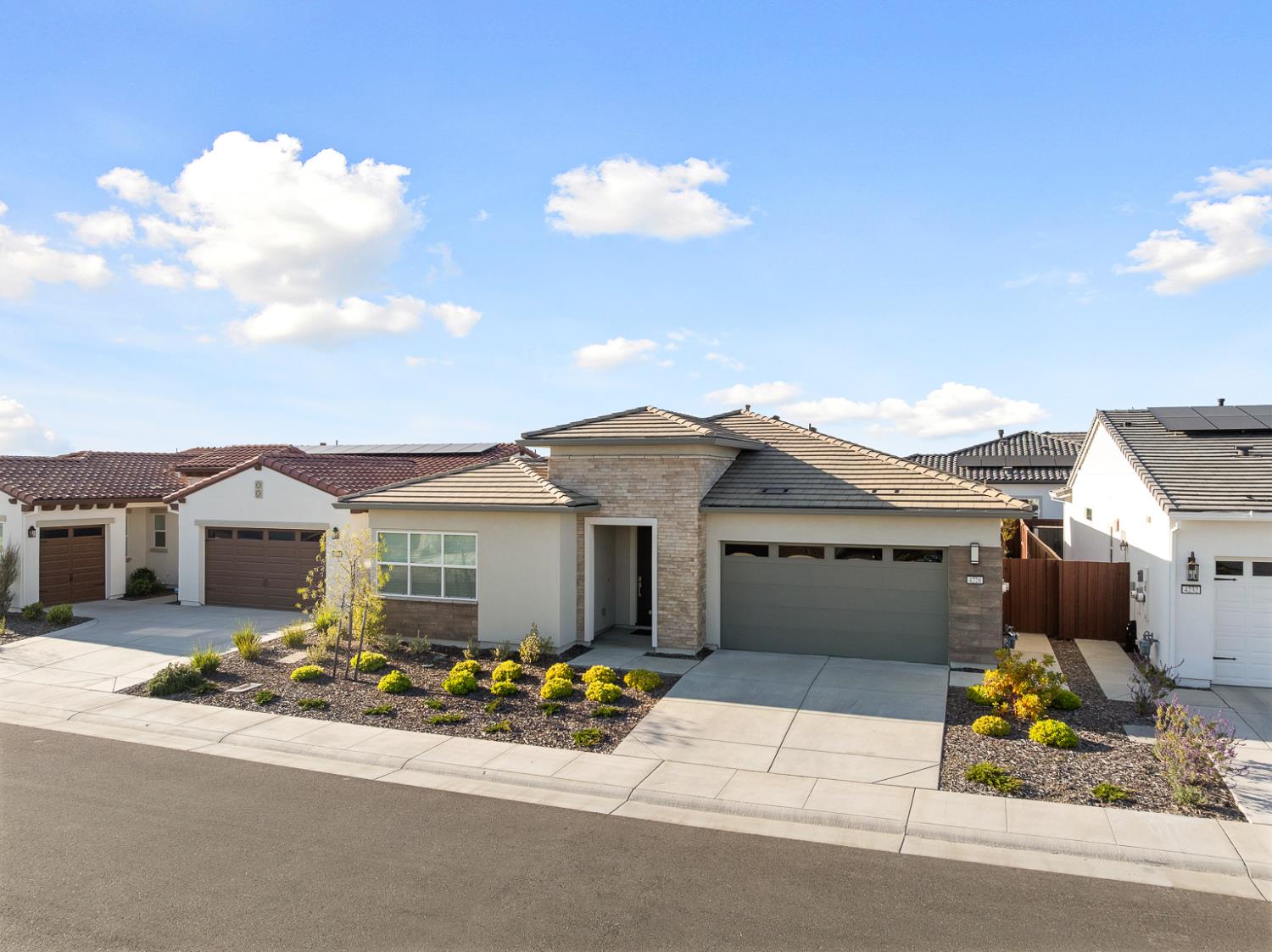 4228 Grey Hawk Street Folsom, CA 95630 - Photo 2 of 49 a front view of a house with a yard and garage