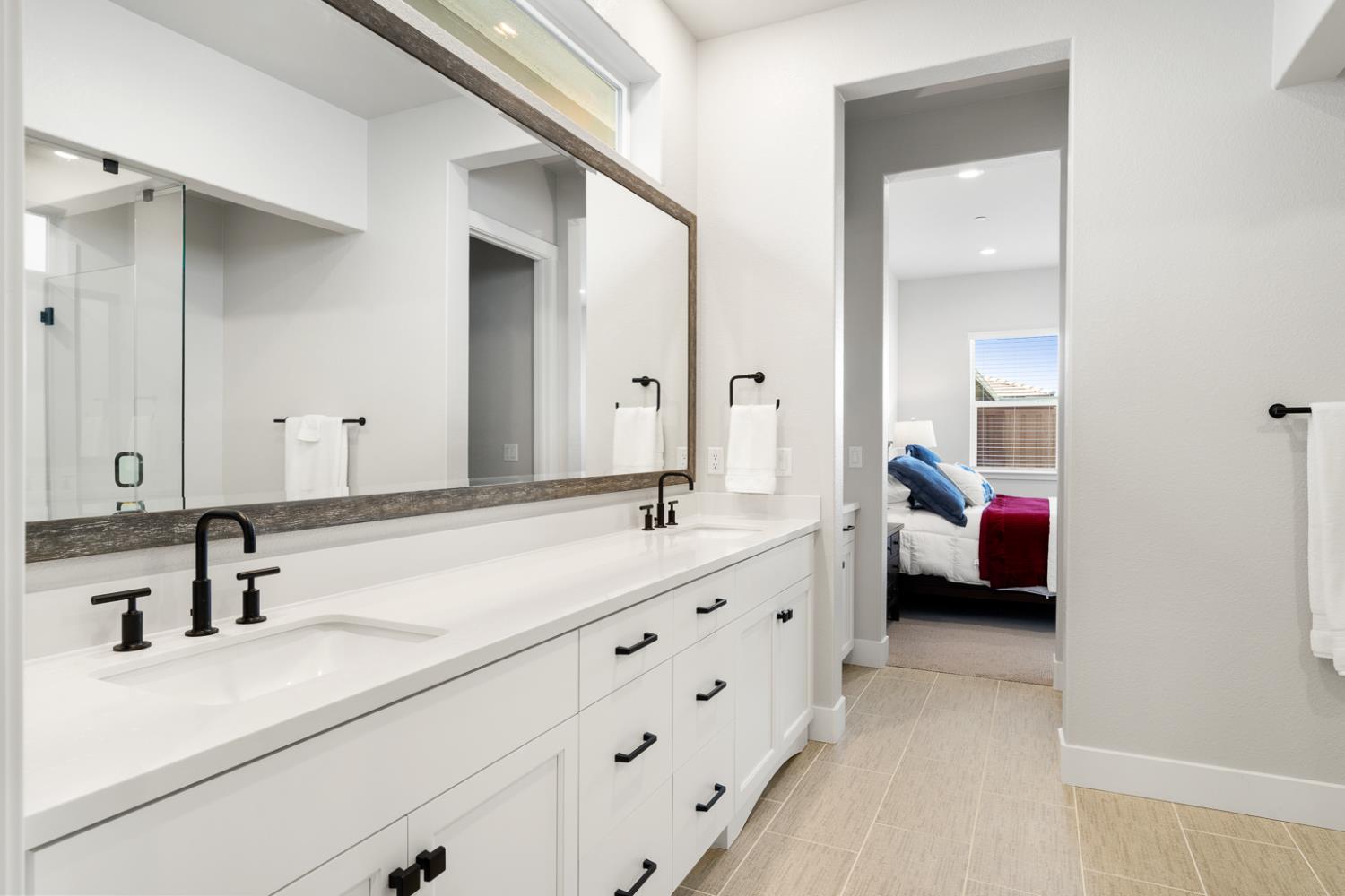4228 Grey Hawk Street Folsom, CA 95630 - Photo 24 of 49 a en suite bathroom with a double vanity sink and mirror