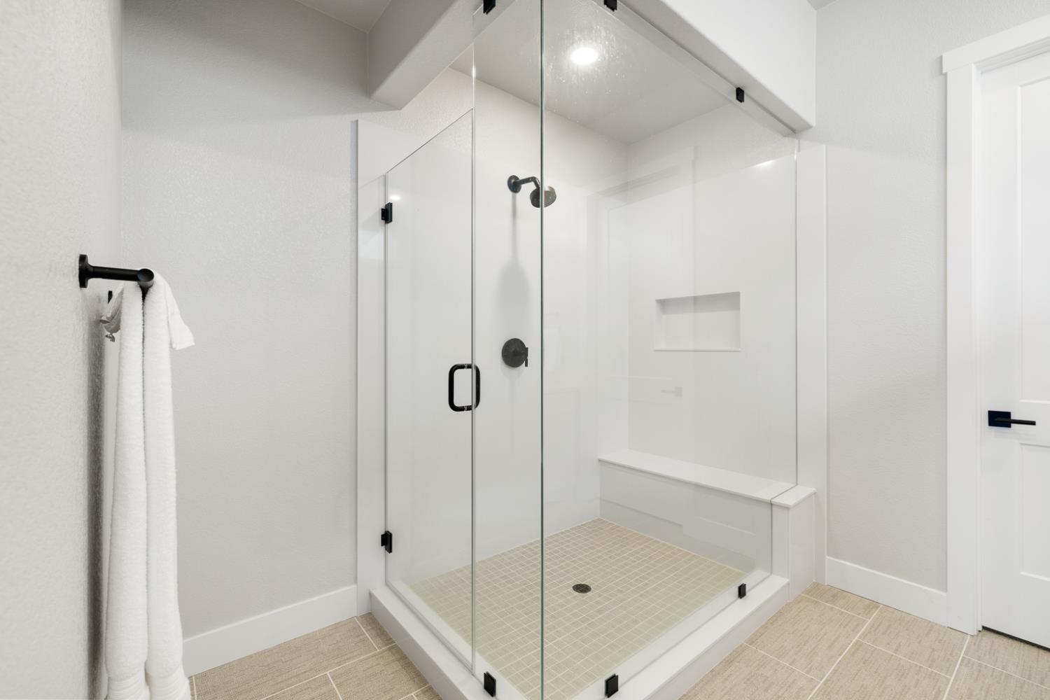 4228 Grey Hawk Street Folsom, CA 95630 - Photo 25 of 49 a bathroom with a glass shower door