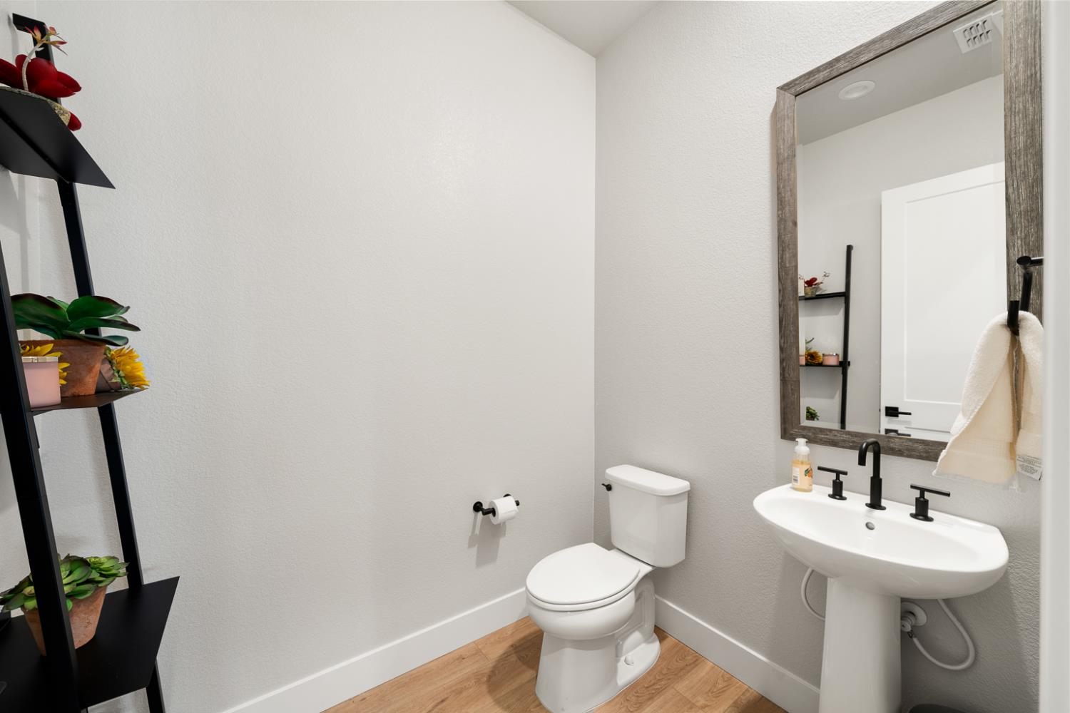4228 Grey Hawk Street Folsom, CA 95630 - Photo 32 of 49 a bathroom with a toilet sink and mirror