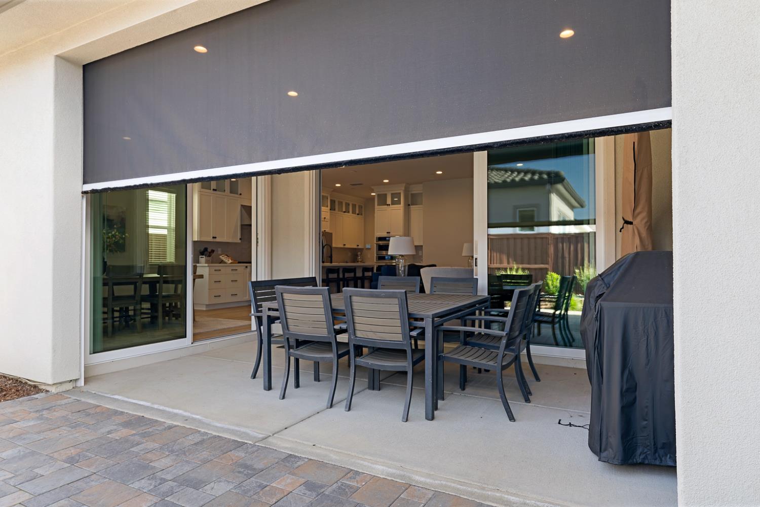 4228 Grey Hawk Street Folsom, CA 95630 - Photo 38 of 49 a dining room with furniture and a floor to ceiling window