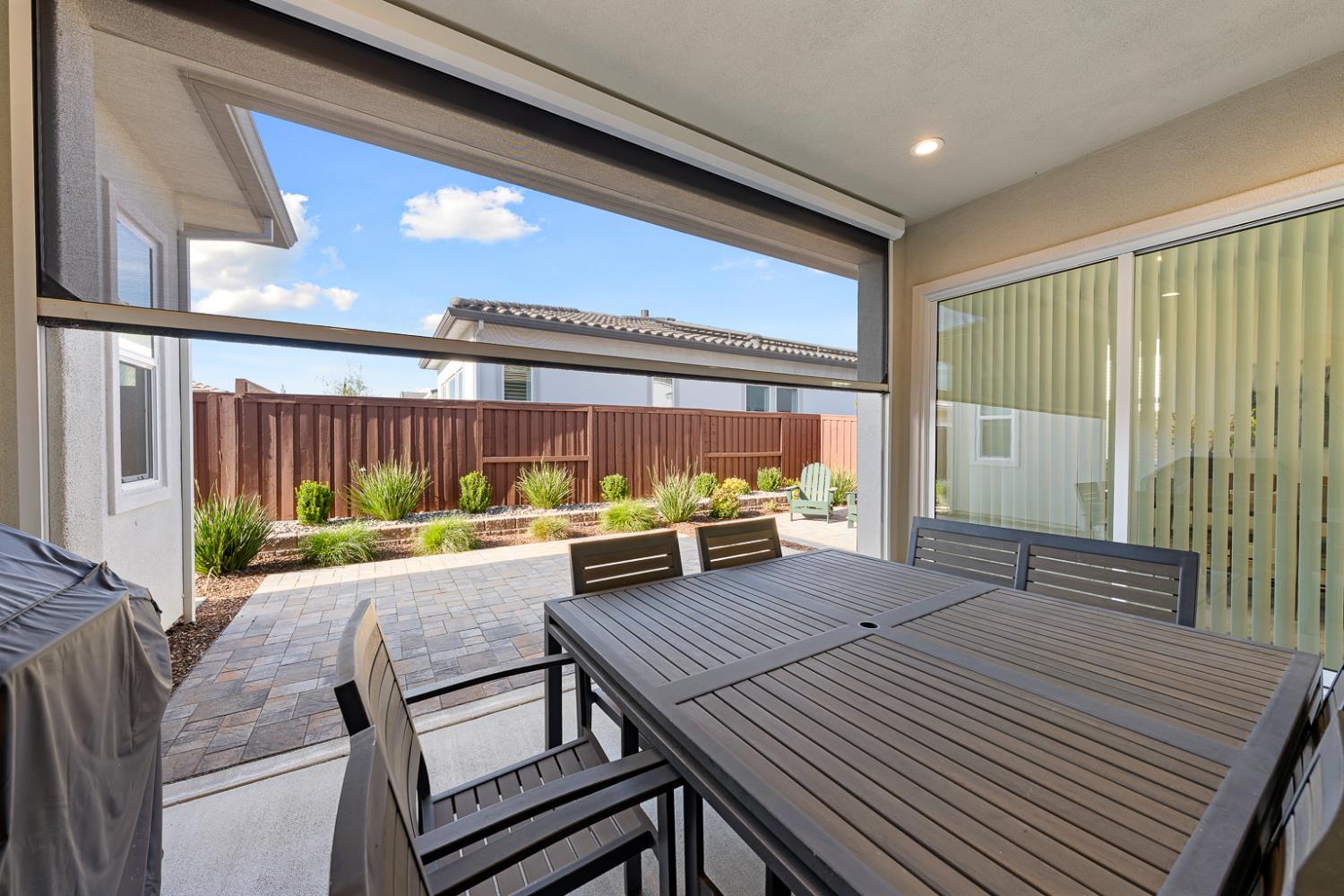 4228 Grey Hawk Street Folsom, CA 95630 - Photo 39 of 49 a view of a patio with table and chairs with wooden floor and fence