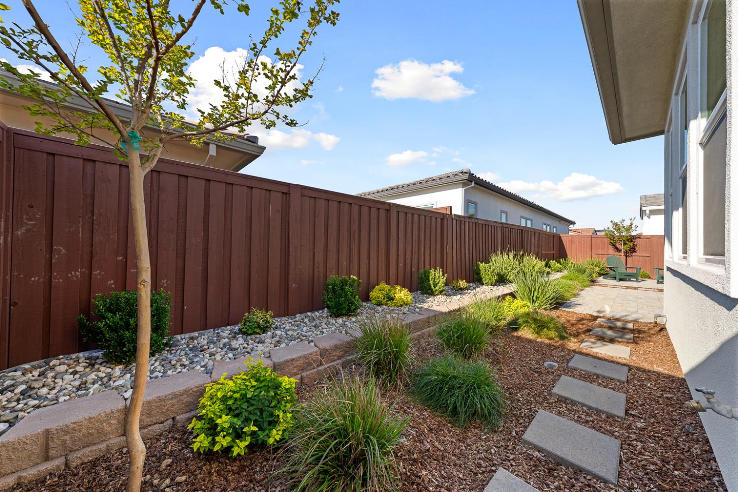 4228 Grey Hawk Street Folsom, CA 95630 - Photo 42 of 49 a backyard of a house with a garden