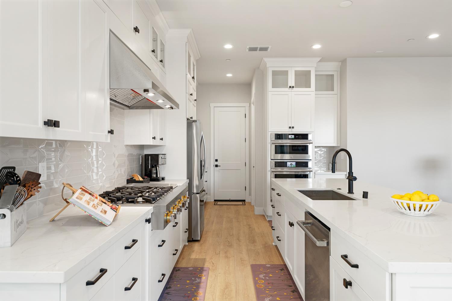 4228 Grey Hawk Street Folsom, CA 95630 - Photo 6 of 49 a kitchen with kitchen island stainless steel appliances a sink a stove and a refrigerator