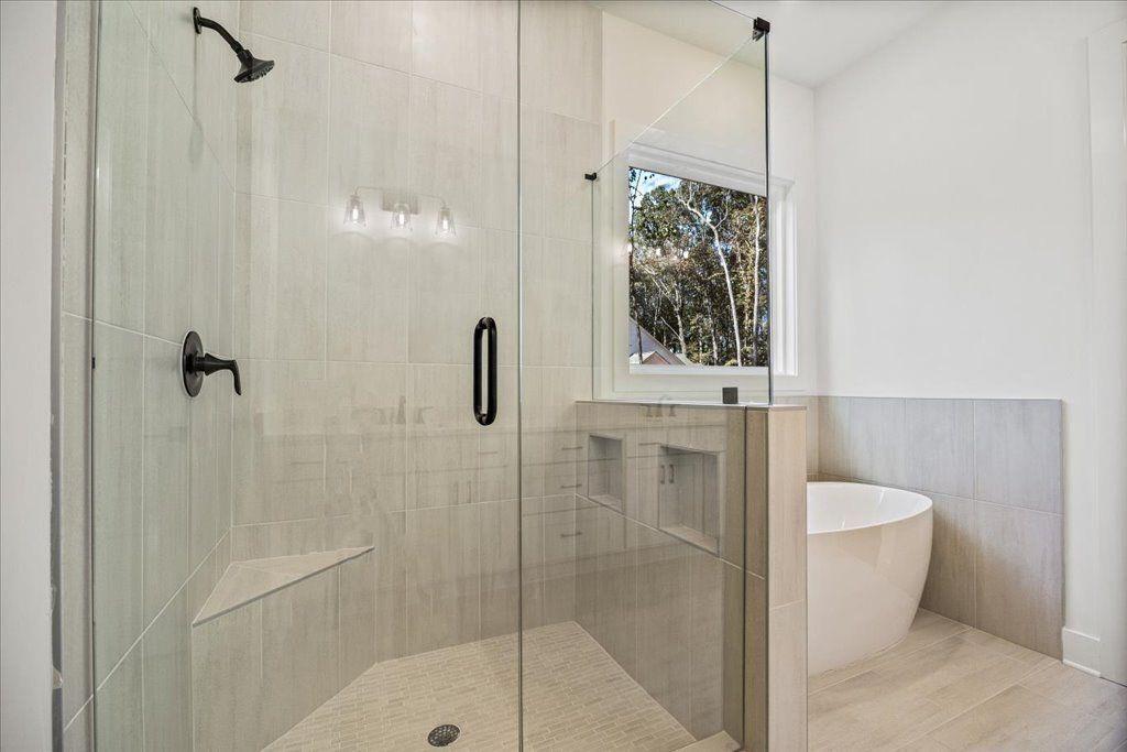 8280 Scarlett Grace Lane Gainesville, GA 30506 - Photo 16 of 48 a bathroom with a shower and a toilet