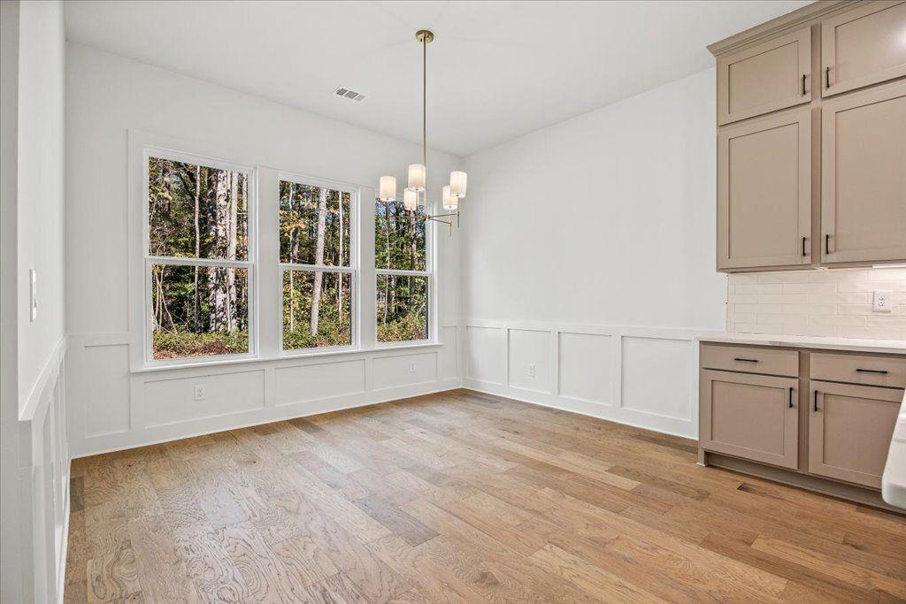 8280 Scarlett Grace Lane Gainesville, GA 30506 - Photo 23 of 48 a view of an empty room with window and cabinet