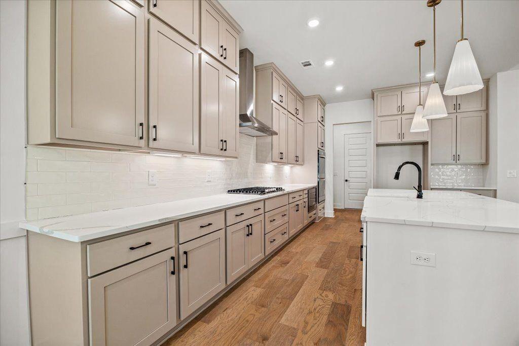 8280 Scarlett Grace Lane Gainesville, GA 30506 - Photo 25 of 48 a large kitchen with stainless steel appliances lots of counter space sink and cabinets