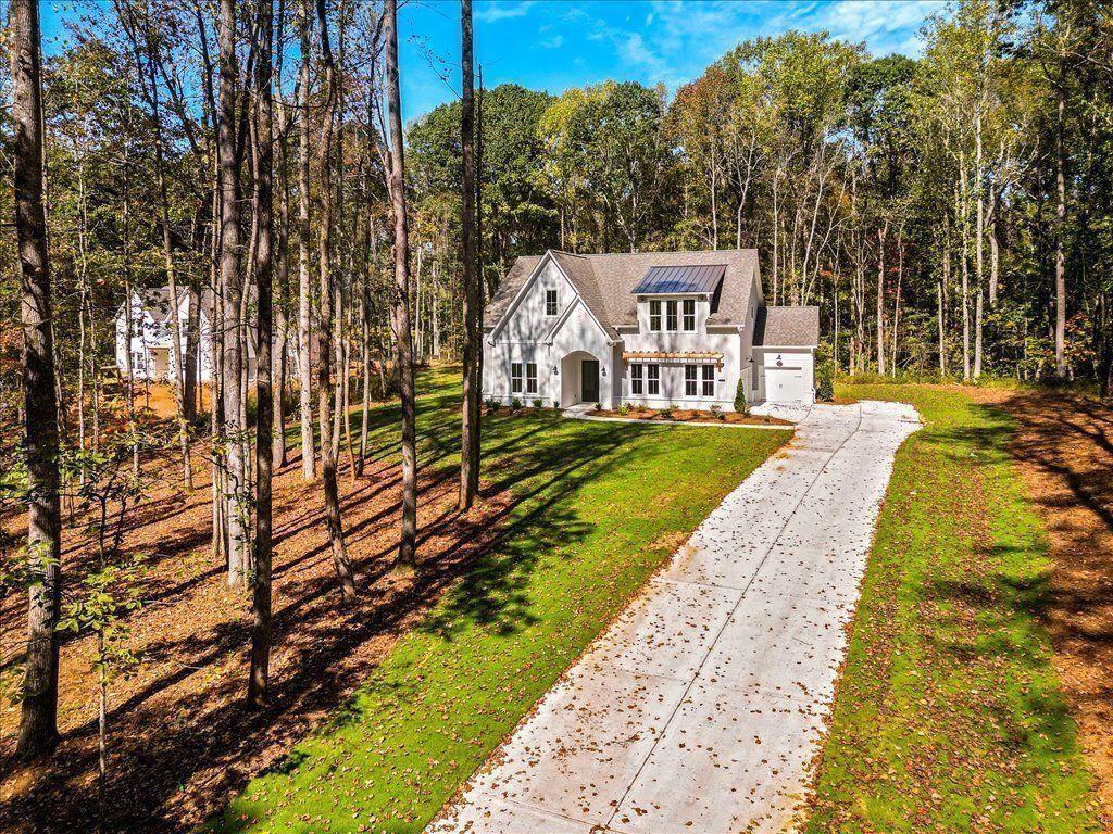 8280 Scarlett Grace Lane Gainesville, GA 30506 - Photo 3 of 48 a view of a house with a yard