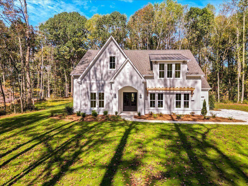 8280 Scarlett Grace Lane Gainesville, GA 30506 - Photo 4 of 48 a front view of a house with a yard