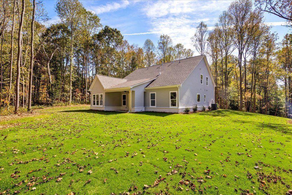 8280 Scarlett Grace Lane Gainesville, GA 30506 - Photo 47 of 48 a front view of a house with yard and trees