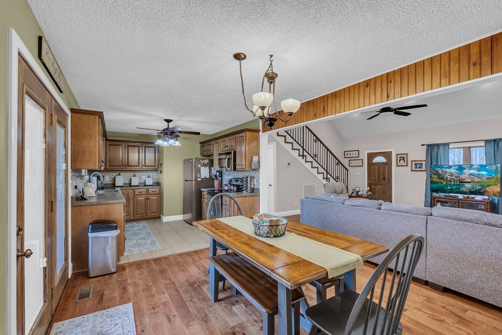 465 Hickory Lane Sparta, TN 38583 - Photo 29 of 46 a living room with lots of furniture and kitchen view