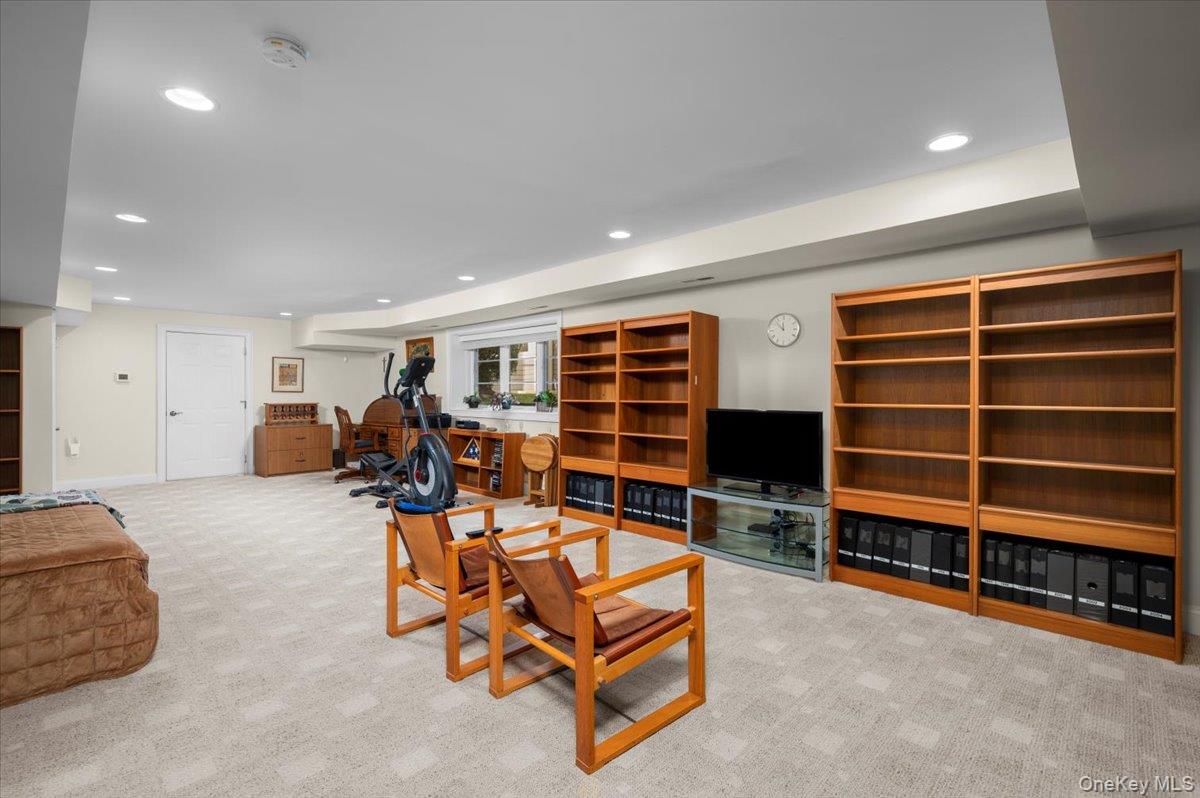 775 Scarsdale Road, Unit 7 Tuckahoe, NY 10707 - Photo 18 of 27 a view of a livingroom with furniture and gym equipment