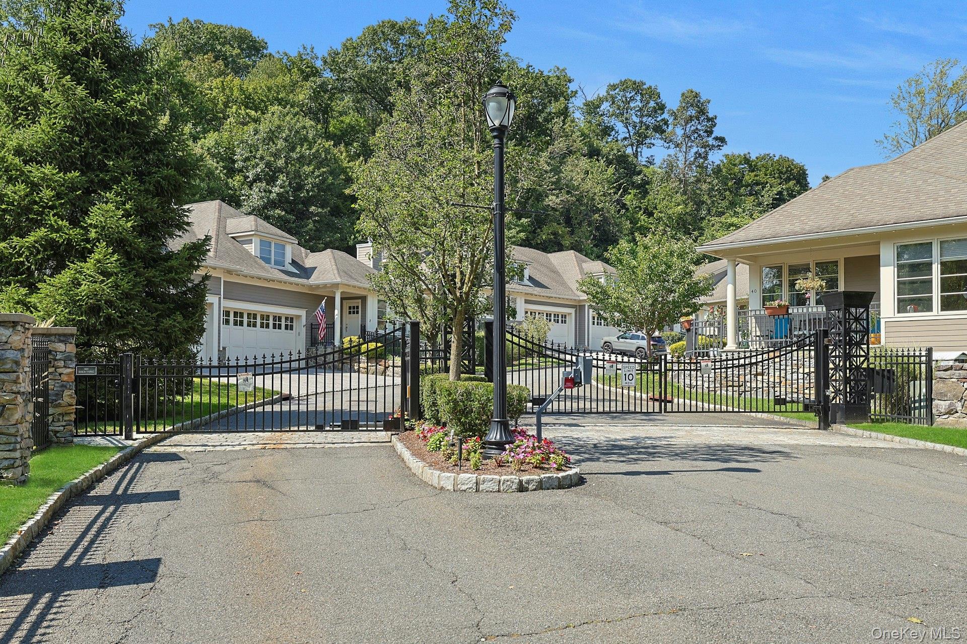 775 Scarsdale Road, Unit 7 Tuckahoe, NY 10707 - Photo 21 of 27 a view of a house with a small yard and large trees