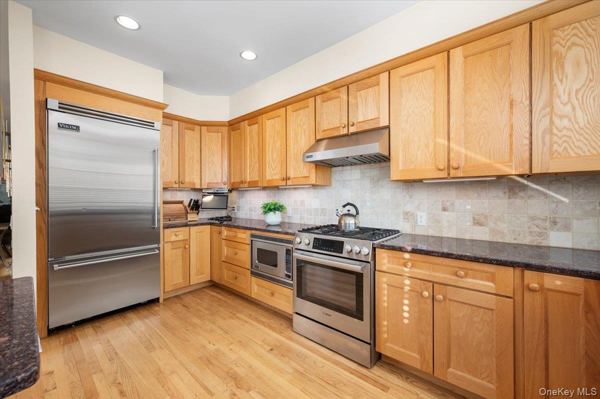 775 Scarsdale Road, Unit 7 Tuckahoe, NY 10707 - Photo 5 of 27 a kitchen with granite countertop white cabinets and stainless steel appliances