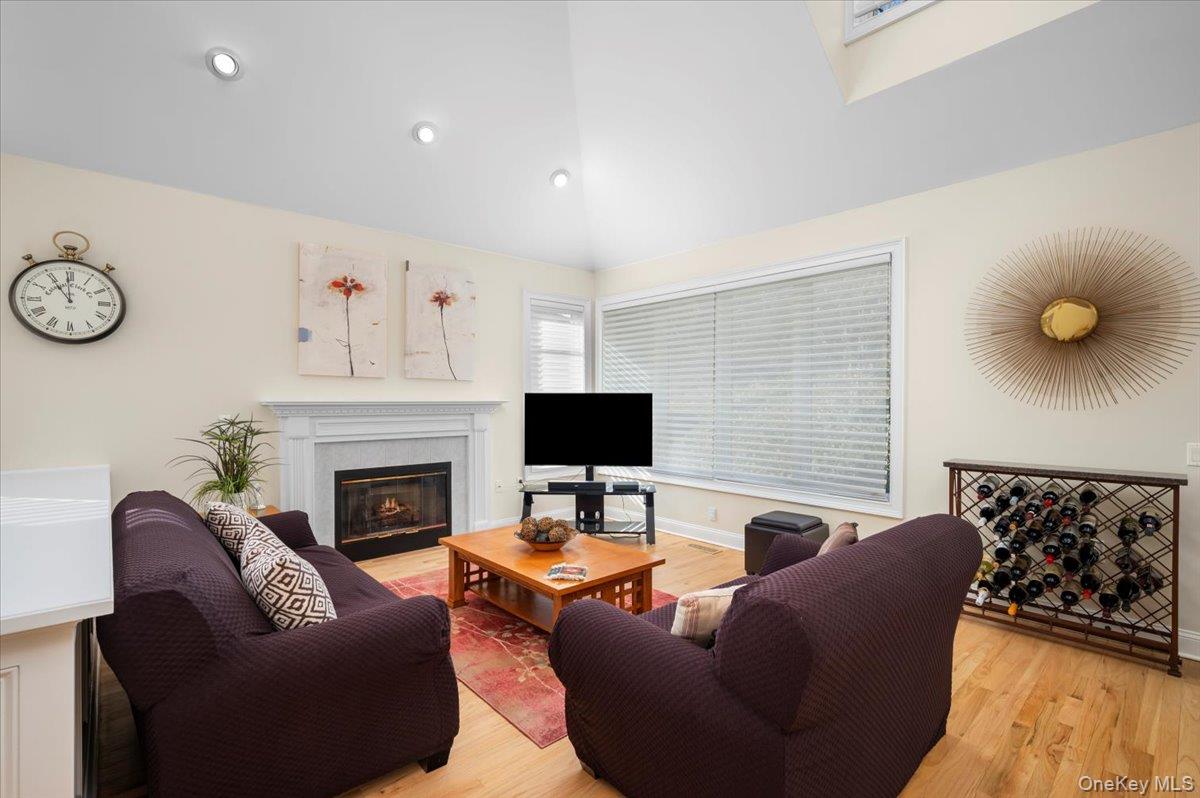 775 Scarsdale Road, Unit 7 Tuckahoe, NY 10707 - Photo 7 of 27 a living room with furniture wall paintings and a fireplace