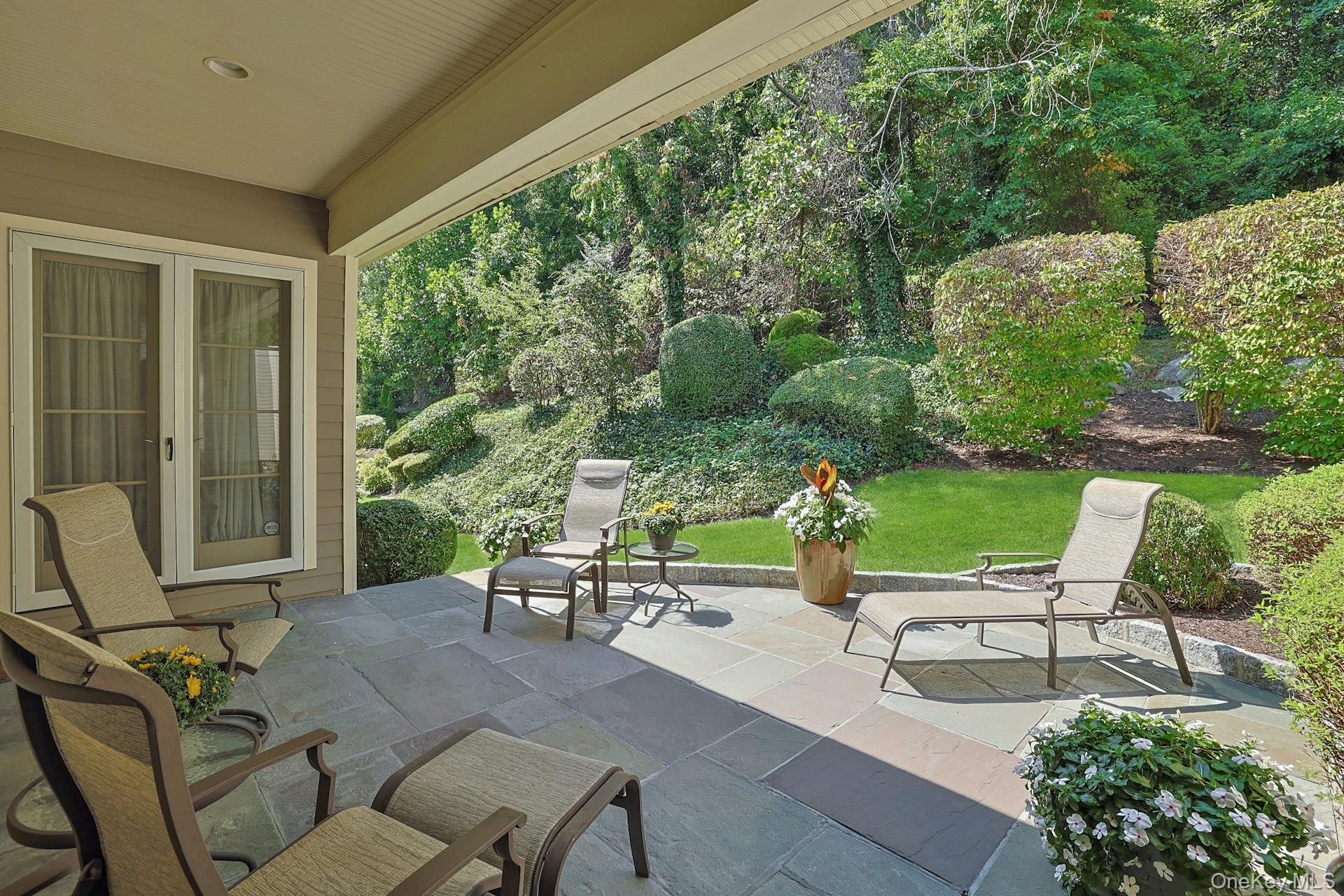 775 Scarsdale Road, Unit 7 Tuckahoe, NY 10707 - Photo 8 of 27 a view of a patio with table and chairs potted plants with garden view