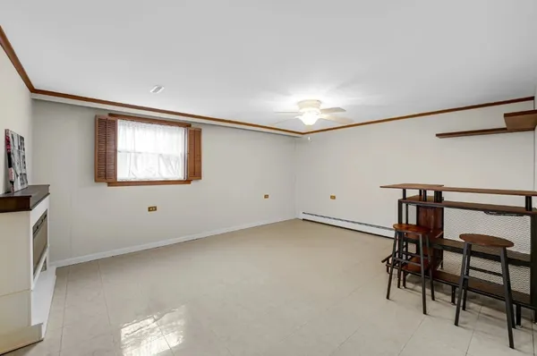 a view of workspace with furniture and window