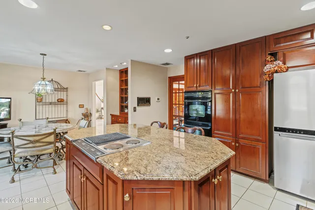 a living room with furniture a lamp and a large window