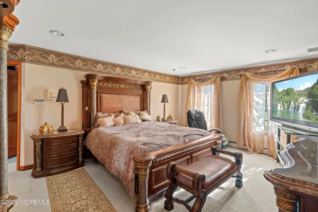 a bedroom with furniture and a window