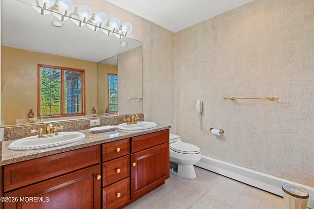 a backyard of a house with a yard and large trees